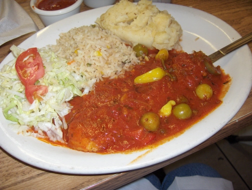 Veracruz style fish fillet with salad, rice, and mashed potatoes