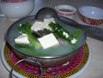 Hot pot with shrimp, tofu, and Chinese broccoli