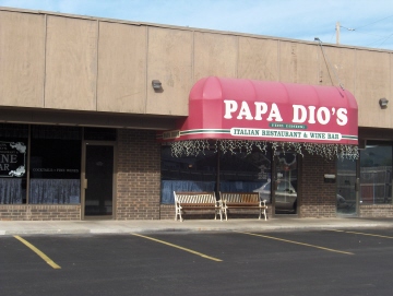 Papa Dio's is actually two restaurants in one: The right door (under the sign) leads to the regular restaurant.  
The left door is the entrance to the wine bar
