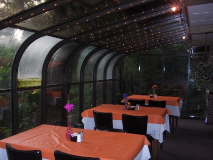 The glass enclosed dining room